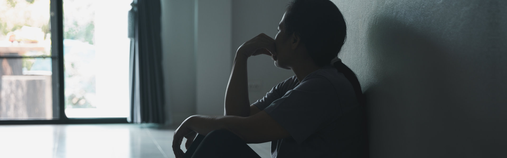 woman sitting in the corner