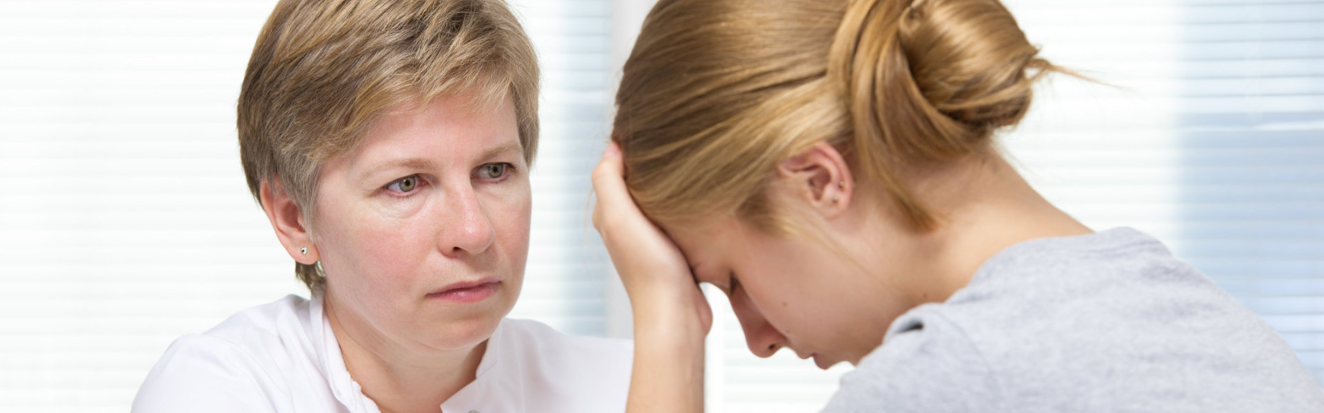 psychiatrist comforting a girl